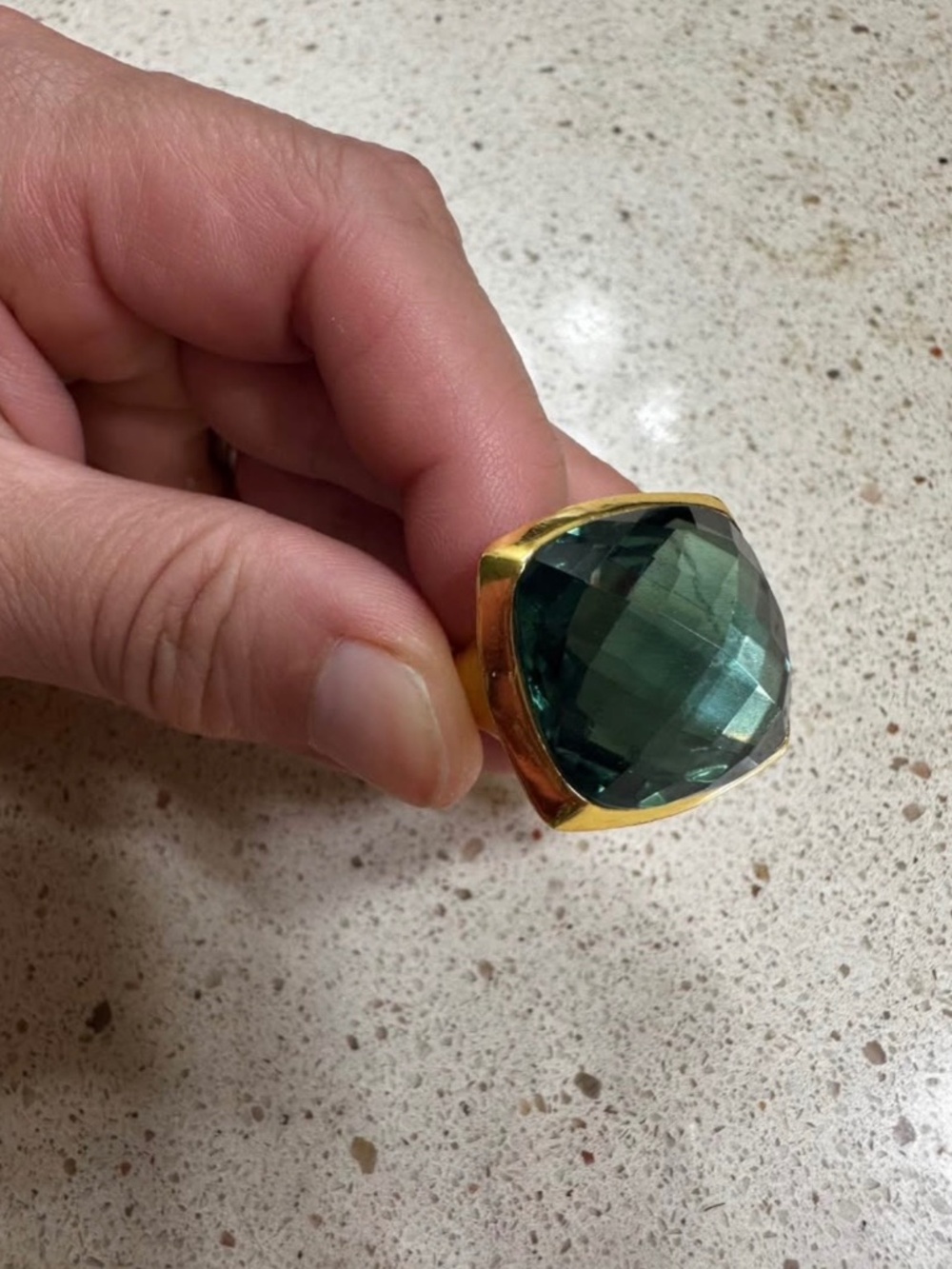 Emerald colored statement ring